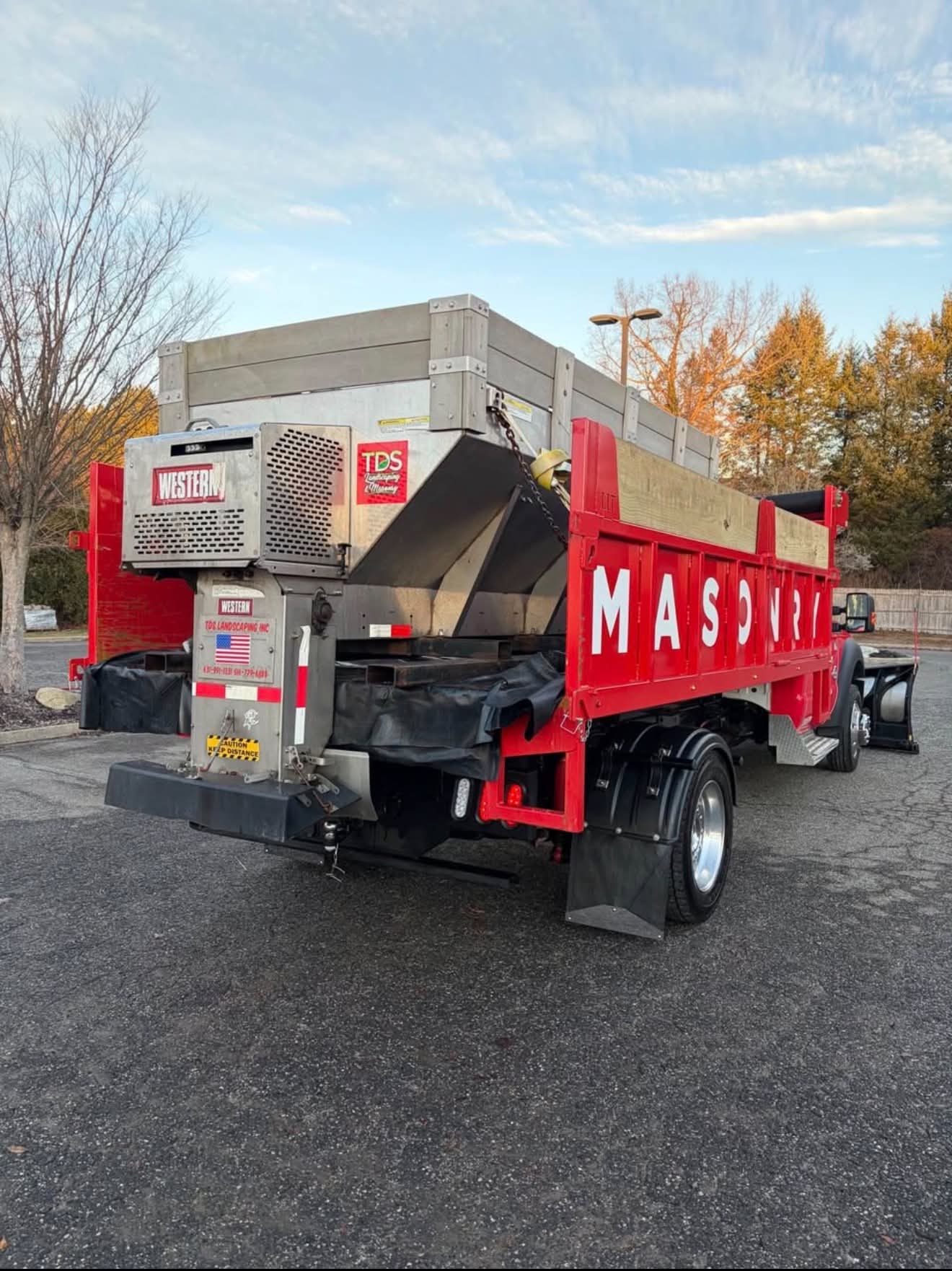 Red dump body with spreader built by Long Island Truck Bodies